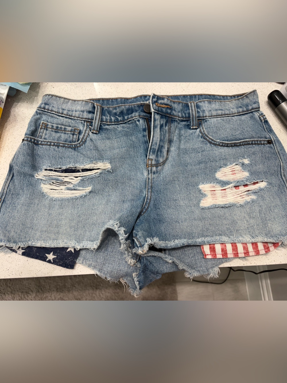 Distressed Light Blue Denim Shorts with Flag Patch Detail